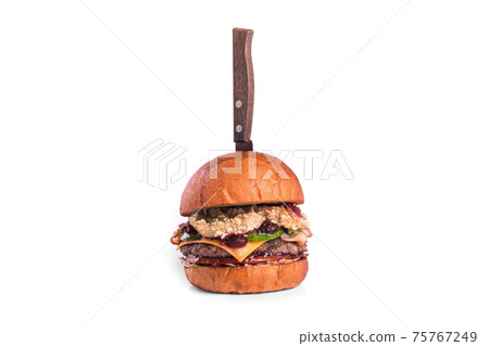 Very luscious air bun and marbled beef. Delicious beef burger decorated with knife on a white background. Very luscious air bun and marbled beef. Delicious beef burger decorated with knife on a white background. 75767249
