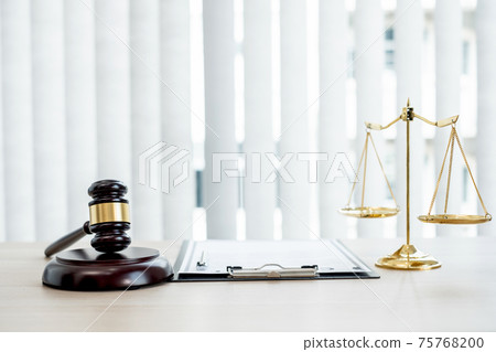 The judge's gavel at the law firm has scales, scales of justice, and litigation documents. Concepts of law and justice 75768200