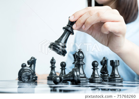 The hands of businesswomen moving chess in chess competitions demonstrate leadership, followers, and strategic plans, business success building processes, and teamwork The hands of businesswomen moving chess in chess competitions demonstrate leadership, followers, and strategic plans, business success building processes, and teamwork 75768260