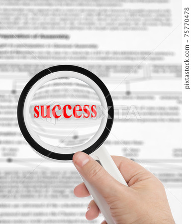 Magnifying glass in hand and word Success Magnifying glass in hand and word Success 75770478