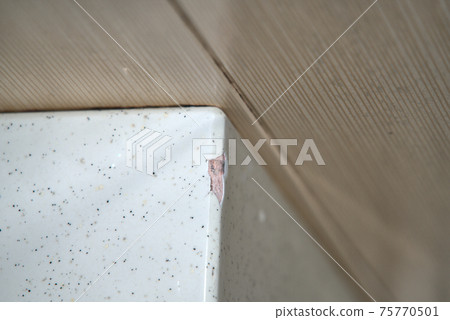 The edge of the bathtub with cracks on the surface The edge of the bathtub with cracks on the surface 75770501