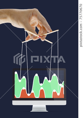 Businessman keeping the growth in economy, manipulating graphs like puppet Businessman keeping the growth in economy, manipulating graphs like puppet 75770670