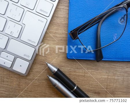 Business image · notebook · glasses · keyboard 75771102