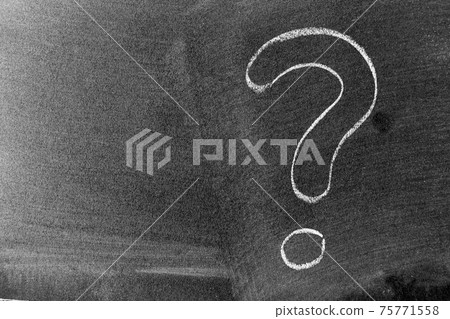 White color chalk hand drawing in question mark shape on blackboard or chalkboard background with copy space 75771558