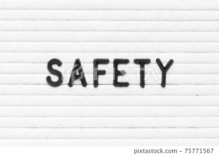 Black color letter in word safety on white felt board background Black color letter in word safety on white felt board background 75771567