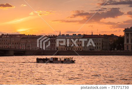 Small tourist boat with tourists is on a boat trip 75771730
