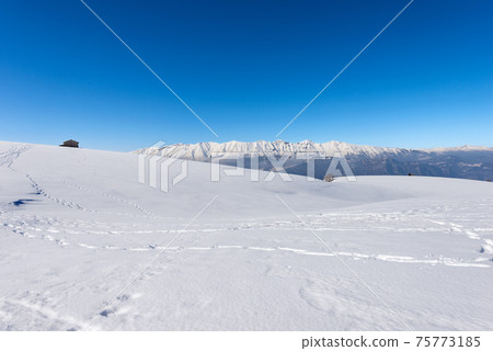 Mountain Range of Monte Baldo and Adamello view from Lessinia Plateau - Italy 75773185