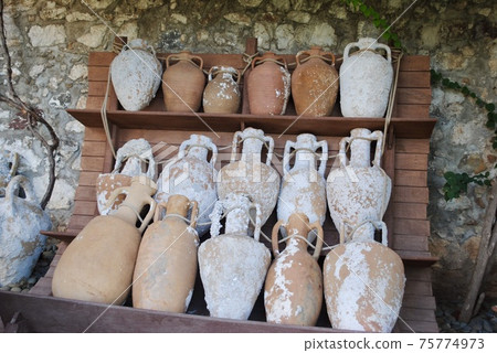 Marmaris Turkey. Ancient Amphoras displaying at the museum garden. Amphora is Greco-Roman word, a container using for storage and delivered by land or sea dated back to Neolithic Period. 75774973