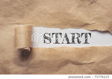 Business and finance. Torn brown paper on a white background, the text - Start Business and finance. Torn brown paper on a white background, the text - Start 75776225