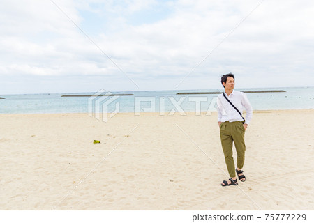 Men sightseeing in Maesato Beach Men sightseeing in Maesato Beach 75777229