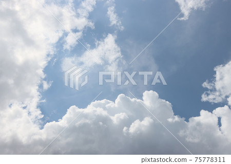 Summer clouds against the blue sky. Summer clouds against the blue sky. 75778311