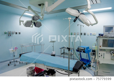 The operating room in the hospital with all the equipment in white and blue. The operating room in the hospital with all the equipment in white and blue. 75779399