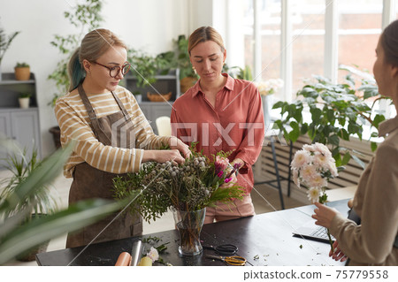 Two Female Florists Creating Composition in Workshop Two Female Florists Creating Composition in Workshop 75779558