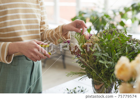 Florist Creating Bouquet Close Up 75779574