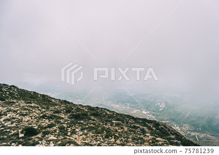 cloudy day with fog in the mountains of the natural park of the ports, in tarragona (spain) cloudy day with fog in the mountains of the natural park of the ports, in tarragona (spain) 75781239