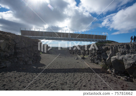 Bridge between continents bottom view, Hafnir, Iceland 75781662