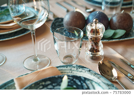 Beautiful elegant table setting with green stylish dishware and silver cutlery Beautiful elegant table setting with green stylish dishware and silver cutlery 75783000