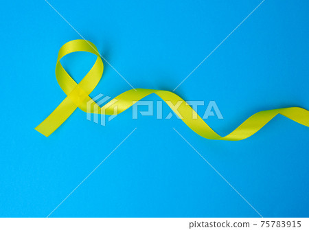 yellow silk ribbon loop on a blue background yellow silk ribbon loop on a blue background 75783915