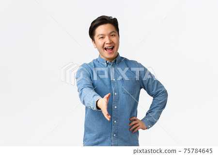Friendly happy smiling asian man with braces saying nice to meet you, extend hand forward for handshake, greeting someone, welcome to office, introduce himself on interview, white background Friendly happy smiling asian man with braces saying nice to meet you, extend hand forward for handshake, greeting someone, welcome to office, introduce himself on interview, white background 75784645