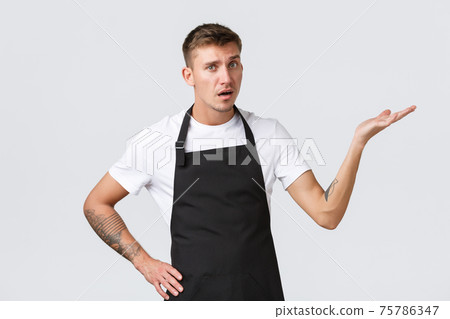 Employees, grocery stores and coffee shop concept. Disappointed and annoyed waiter, barista pointing right and looking displeased, complaining over bad job done, white background 75786347