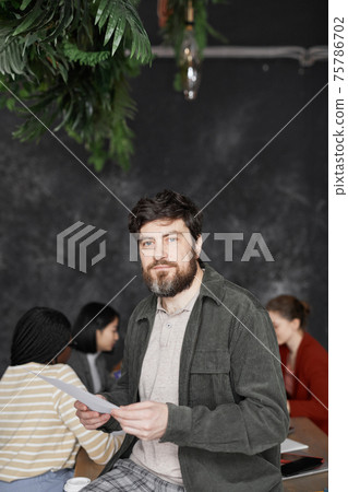 Modern Bearded Businessman in Meeting 75786702