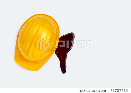 Construction helmet with blood on white background. Construction helmet with blood on white background. 75787483