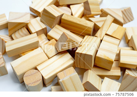 Wooden building blocks on white background. 75787506