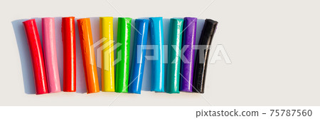 Colorful plasticine clay on white background. Colorful plasticine clay on white background. 75787560