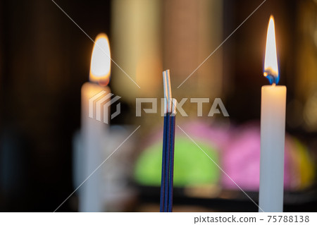 Altar_candles and incense sticks 75788138