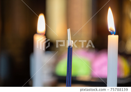 Altar_candles and incense sticks 75788139