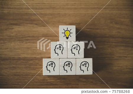Wooden cube block with head human and cog symbol and light bulb icon Wooden cube block with head human and cog symbol and light bulb icon 75788268