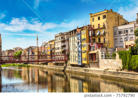 Colorful houses and Eiffel bridge in Girona 75792790
