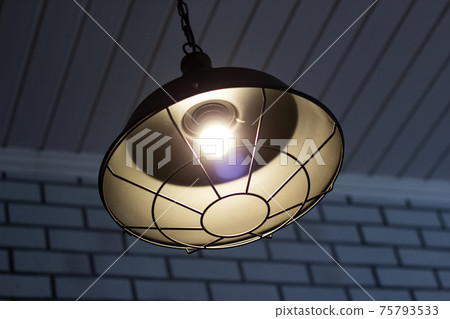 Retro style chandelier in dark close up Retro style chandelier in dark close up 75793533