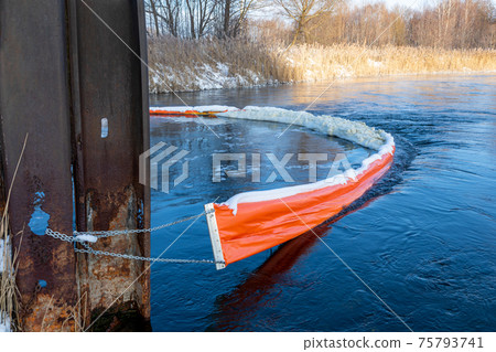The floating boom prevents foam and debris from contaminating the reservoir. Reducing harmful emissions. Protection of rivers and lakes. Keeping fresh water sources clean. Ecological concept. 75793741