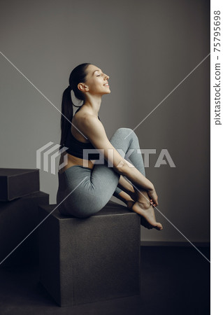 A beautiful girl is engaged in a gym A beautiful girl is engaged in a gym 75795698