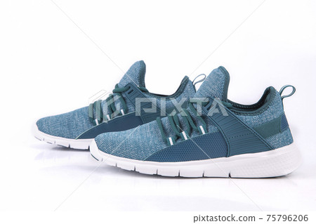 Green sneakers or sport running shoe isolated on a white background 75796206
