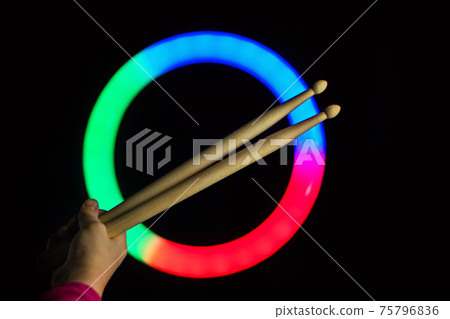 Child Hand Hold Drum Sticks. Rock Music Concept. 75796836