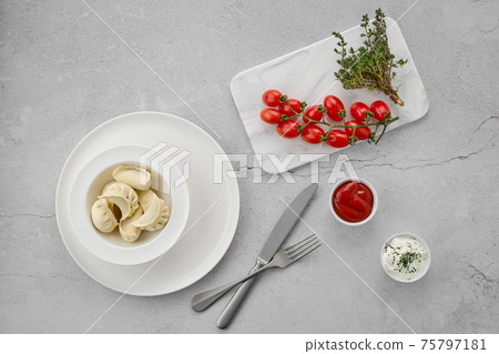 Top view of frozen semifinished dumplings stuffed with meat 75797181