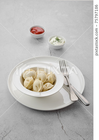 Frozen semifinished dumplings stuffed with meat Frozen semifinished dumplings stuffed with meat 75797186