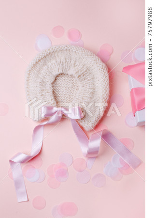 White warm handknitted baby bonnet for little girl or boy and gift box - concept of first step, birthday party, baby shower, anniversary. Little booties for newborn baby, mother day 75797988