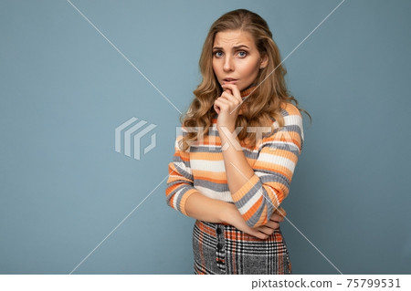 Photo portrait of young attractive beautiful sad upset thoughtful blonde woman with sincere emotions 75799531