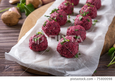 Georgian beetroot phali or pkhali with walnuts, garlic and spices on wooden background Georgian beetroot phali or pkhali with walnuts, garlic and spices on wooden background 75800098