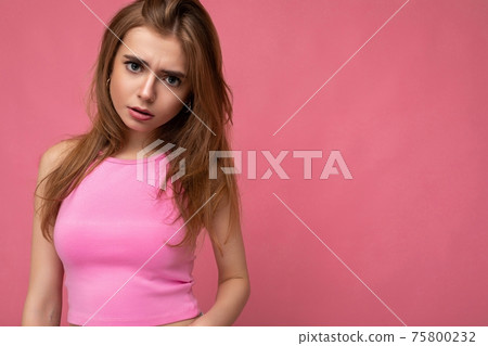 Sad upset young beautiful dark blond woman isolated on background with copy space wearing stylish Sad upset young beautiful dark blond woman isolated on background with copy space wearing stylish 75800232
