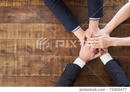 Asian business person laying hands on the table Asian business person laying hands on the table 75800477