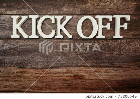 Kick Off alphabet letters on wooden background 75800549