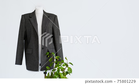 Sustainable fashion, organic clothes, eco clothing, ecology, sustainability, responsible fashion, 100 cotton. Formal Bio fabric suit with green plants on light background. Sustainable fashion, organic clothes, eco clothing, ecology, sustainability, responsible fashion, 100 cotton. Formal Bio fabric suit with green plants on light background. 75801229