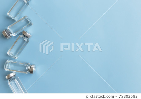 Medicine treatment, vaccination concept. Bottles with vaccine, antibiotic 75802582