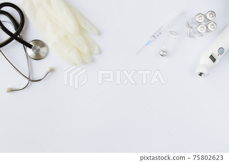 Vial with vaccine and syringe, thermometer and stethoscope, white gloves Vial with vaccine and syringe, thermometer and stethoscope, white gloves 75802623