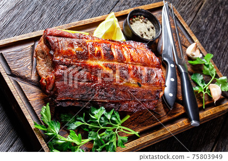 Barbecued Pork Loin Roast on a wooden board 75803949
