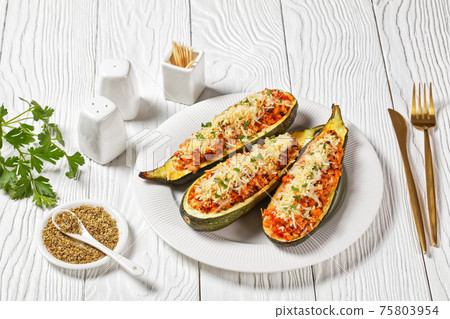 zucchini boats with ground meat, top view zucchini boats with ground meat, top view 75803954